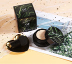 Air Cushion BB Cream in stylish packaging on a flat lay with heart-shaped applicator and decorative backdrop.